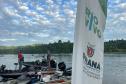 Foto de ação de soltura de peixes